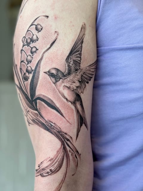 Fine line black and grey portrait arm tattoo