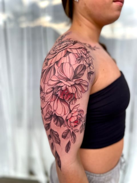 Floral sleeve arm tattoo botanical colour